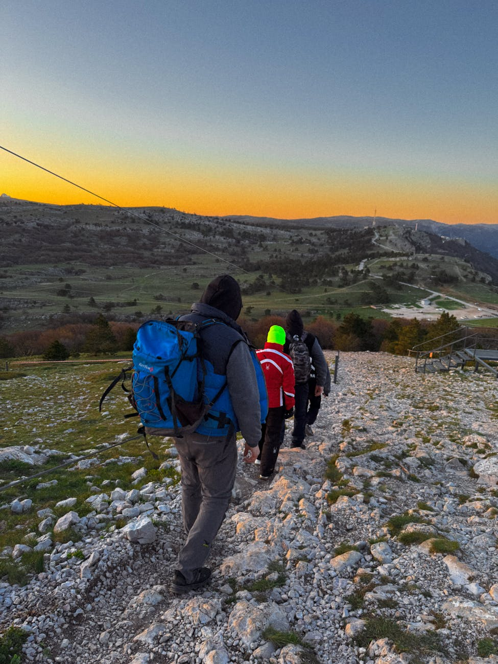 hiking adventure at sunset in mountainous landscape